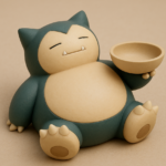 Figurine en céramique de Ronflex tenant un bol